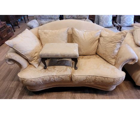 A modern two seater sofa, having feather filled scatter cushion backrests and shaped drop in seat cushions, upholstered in a 