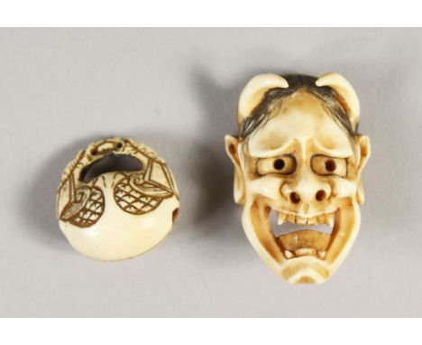 A JAPANESE CARVED IVORY NOH MASK NETSUKE WITH OJIME BEAD, mask depicting the face of the devil, signed to rear, the ojime bea