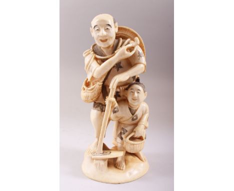 A GOOD JAPANESE MEIJI PERIOD CARVED IVORY OKIMONO OF A MAN &amp; BOY, the man stood with his right foot elevated between tree