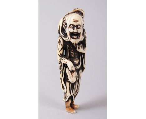 A LARGE JAPANESE EDO PERIOD CARVED IVORY NETSUKE GAMA SENNIN, modelled with his hand upon his beard, a toad upon his back and