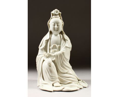 A GOOD CHINESE 19TH CENTURY BLANC DE CHINE PORCELAIN FIGURE OF GUANYIN, knelt with both hands over her right knee holding a s