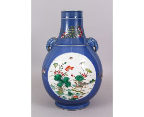 A 19TH CENTURY BLUE BOTTLE VASE, painted with reverse panels of birds and flowers. 32cm high, with Kangxi mark.