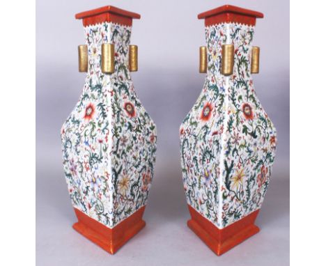 AN UNUSUAL PAIR OF GOOD QUALITY CHINESE FAMILLE ROSE TRIANGULAR SECTION PORCELAIN ARROW VASES, the sides of each well decorat