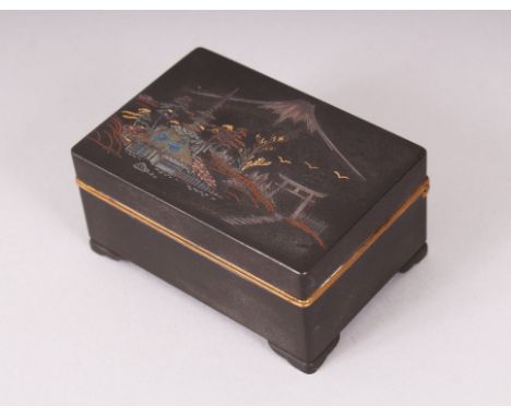 A SMALL JAPANESE IRON KOMAI STYLE DAMASCENED TRINKET BOX, the lid decorated with scenes of mount fuji, the lid opens to revea