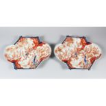 AN UNUSUAL PAIR OF FAN SHAPED JAPANESE IMARI PLATES, late 19th century, finely decorated in under
