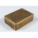 A CHINESE BRONZE INK BOX, WITH CARVED AND SIGNED LID, with scenes of warriors around trees, 10cm
