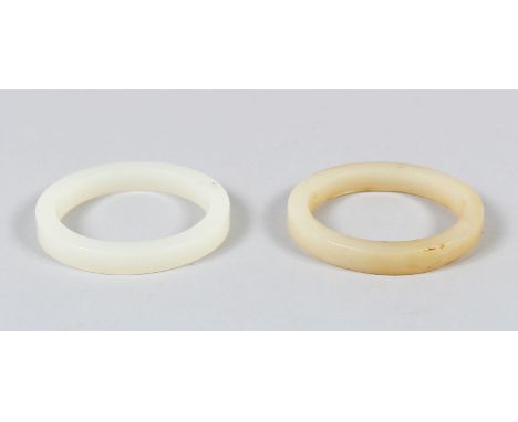 A CHINESE WHITE JADE BANGLE, also another similar jade bangle, 7.5cm diameter.