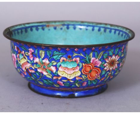 A GOOD QUALITY EARLY 19TH CENTURY CHINESE CANTON ENAMEL BOWL, the sides decorated with a profusion of flowers and the Eight B