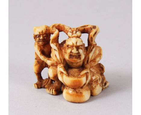 A GOOD JAPANESE MEIJI PERIOD CARVED IVORY NETSUKE, depicting Shoki and Oni, 3cm.