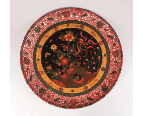 A RARE JAPANESE CERAMIC PLAQUE WITH A TOTEI CLOISONNE CENTRE AND CINNABAR LACQUER, heavily inlaid with abalone shell, the clo