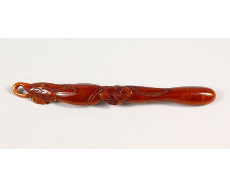 A GOOD JAPANESE STAINED IVORY SASH NETSUKE IN THE FORM OF BEAN PODS, Meiji period, 15cm.