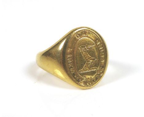 A yellow metal armorial signet ring, no hallmarks, size K, 7.8g, with original box. 