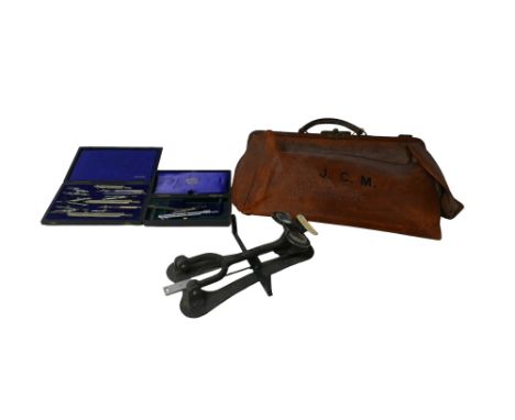 A Stereometer with testing cards, together with two cased compass sets and a vintage Gladstone bag, a/f. (1 box) 