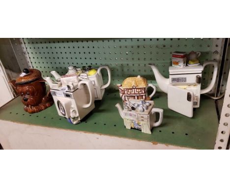 SHELF OF NOVELTY TEA POTS