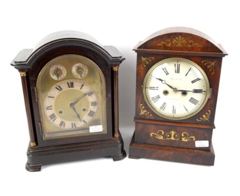Early 20th century German mantel clock, the arched case with column supports enclosing a brass dial with silvered chapter and