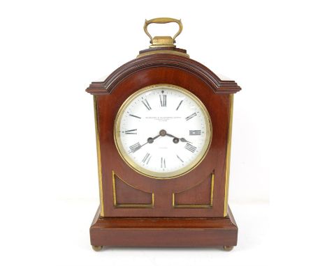 Early 20th century mahogany mantel clock, the arched case with brass handle and brass mounted corners enclosing an enamel dia