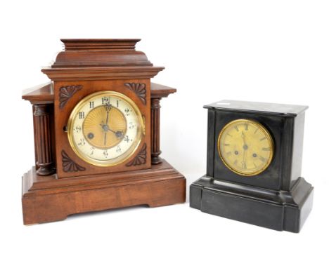 Walnut German mantel clock, of architectural form with ivorine chapter ring, twin train movement striking on a gong, 35 cm hi