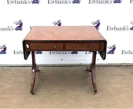 Early 19th century style mahogany sofa table, the drop leaves over two frieze drawers on outsplayed legs with brass caps and 