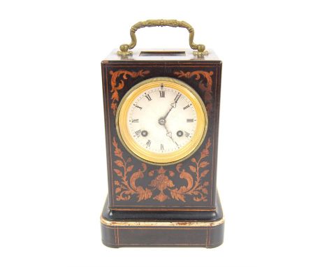 French late 19th century inlaid travel clock, the brass handle over a foliate design enclosing an engine turned dial inscribe