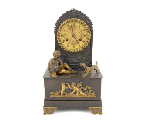 19th century patinated brass mantel clock in the Regency style, the two train movement striking on a bell, the base mounted w