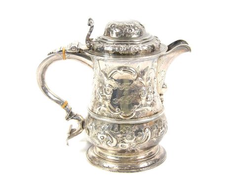 Silver covered tankard, later adapted with spout added and embossed foliate decoration, with cancelled George II marks, Londo