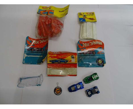 A group of three MATTEL Hot Wheels Redline cars comprising Peeping Bomb, 142 and a Hairy Hauler, unboxed with three backing c