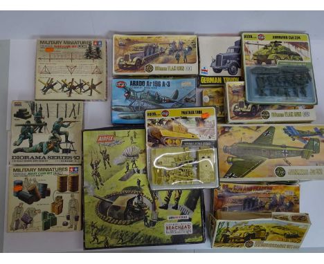 A group of unbuilt plastic kits in various scales by AIRFIX, TAMIYA, ESCI etc - all German military examples - contents unche