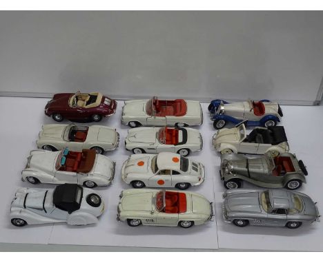 A group of unboxed 1:18 scale diecast cars by POLISTIL, BBURAGO &amp; MAISTO etc plus a DARTMOUTH POTTERY Jaguar E Type -  F/