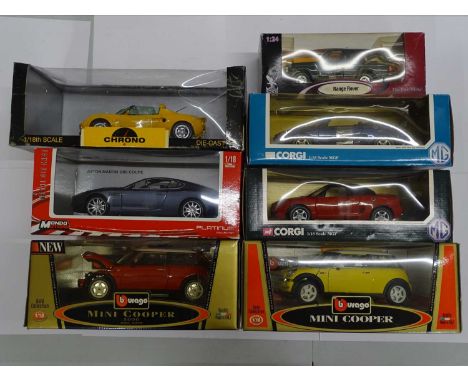 A group of boxed 1:18 scale diecast cars by BBURAGO, CHRONO, MONDO &amp; CORGI plus a 1:24 scale ROAD LEGENDS Range Rover -  