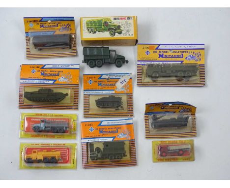 A group of HO scale civilian and military lorries and tanks by ROCO and others - VG in G boxes (10)