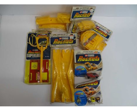 A group of CORGI Rockets comprising 2 x cars on card backing and various accessories G on F/G cards (7)