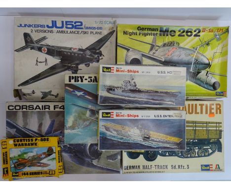 A group of unbuilt plastic kits in various scales by REVELL mostly aircraft examples - contents unchecked, appear complete, m