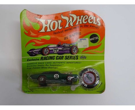 A MATTEL Hot Wheels Redline Exclusive Racing Car Series TNT Bird with button and sticker sheet on original card - partially u