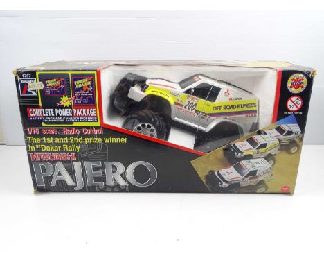 An ASAHI 1:16 scale radio controlled Mitsubishi Pajero, appears complete - G in G box