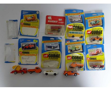 A mixed group of CORGI JUNIOR and HUSKY models - some sealed on original cards, others unsealed but with original bubbles - 5
