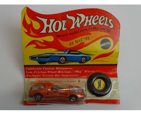 A MATTEL Hot Wheels Redline 1970 'Mod Quad' in metallic copper sealed on original card with button - VG/E on G card (1)