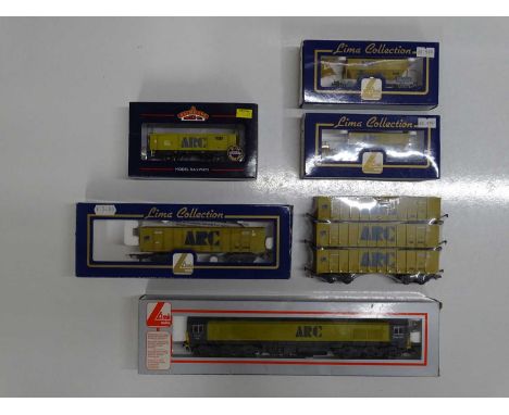 A group of OO gauge rolling stock by LIMA and BACHMANN comprising a class 59 diesel locomotive and various hopper wagons all 