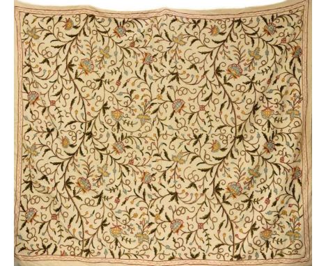A 20th century crewelwork textile panel. Decorated with flowers and foliage, 216cm x 240cm.Areas of light staining, some pull
