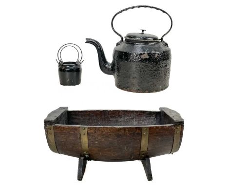 An oak half barrel planter. Length 57cm, together with a cast iron kettle and a cast iron glue pot and liner. (3)