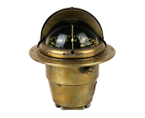 A brass Sestrel Navigator Compass. By Henry Browne & Sons the internal gimbal card diameter 13.5cm, height 18cm.