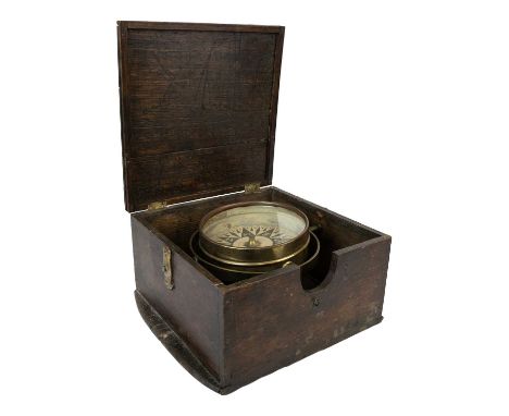 An oak cased dry card gimbal compass. Late 19th century, diameter of dial 13cm, the case width 28cm.