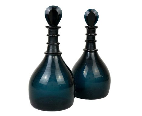 A pair of George III style unusually coloured triple ring neck decanters and stoppers.  Green/blue in hue, total height 26cm.