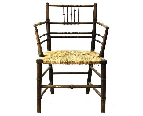 A Sussex type turned ash open armchair. Late 19th century, with ring turned spindles and rush seat, height 79cm, width 54cm, 