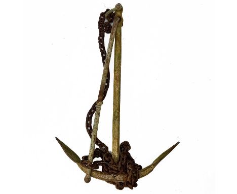 A wrought iron ships anchor. With wrought iron chain, size of anchor 101cm x 68cm x 10cm.