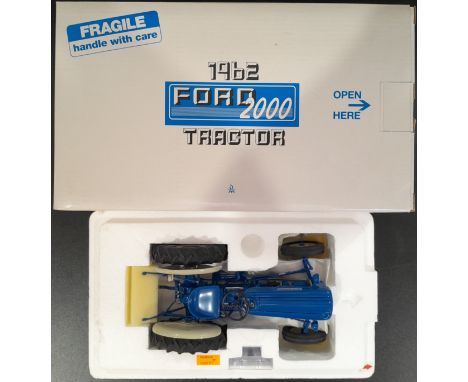 Danbury Mint a boxed 1/16 scale 1962 Ford 2000 Tractor (Blue). Conditions generally appear Near Mint to Mint in generally Goo