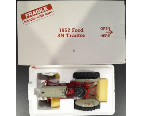 Danbury Mint a boxed 1/16 scale 1952 Ford 8N Tractor. Conditions generally appear Near Mint to Mint in generally Excellent bo