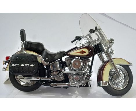 Franklin Mint a unboxed Harley Davidson Heritage Softail Classic. Conditions generally appear Excellent.&nbsp;