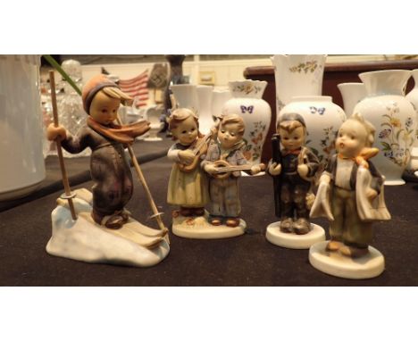 Goebel figurines skier paper boy and children with musical instruments 