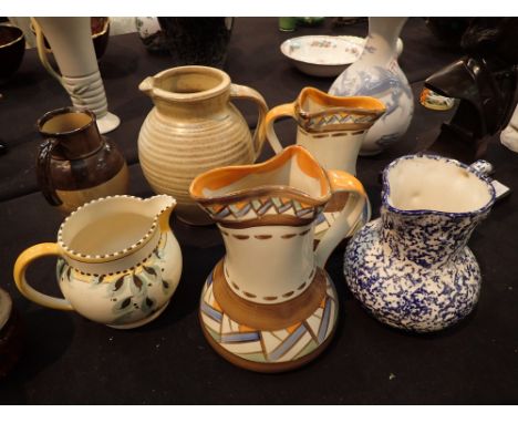 Collection of mixed maker jugs including Wedgwood Myott and Royal Doulton