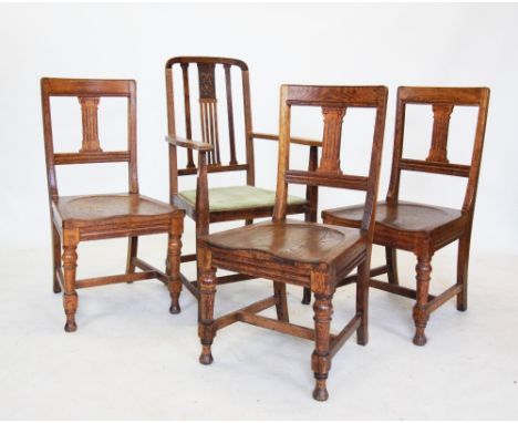 Three late 19th century oak country chairs, each with a plain top rail above an architectural column shaped splat and shaped 